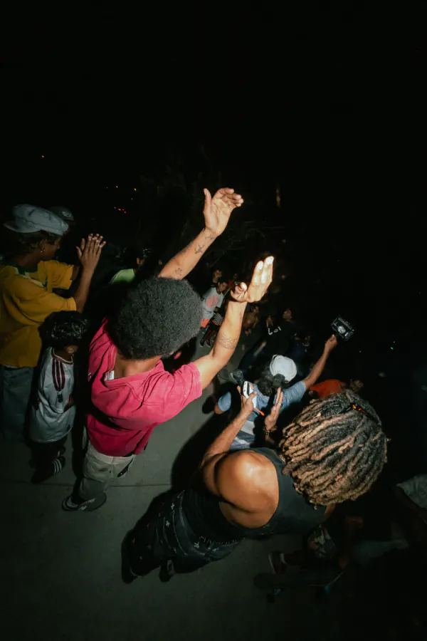 Crowd clapping and cheering during a night skate session