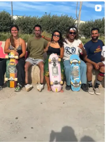 Skaters sitting together at the park on the Casa Skate Club Instagram